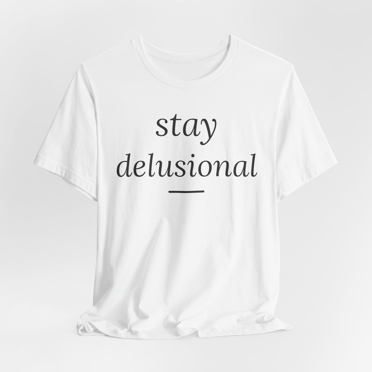 Stay Delusional — Ironic Serif Tee