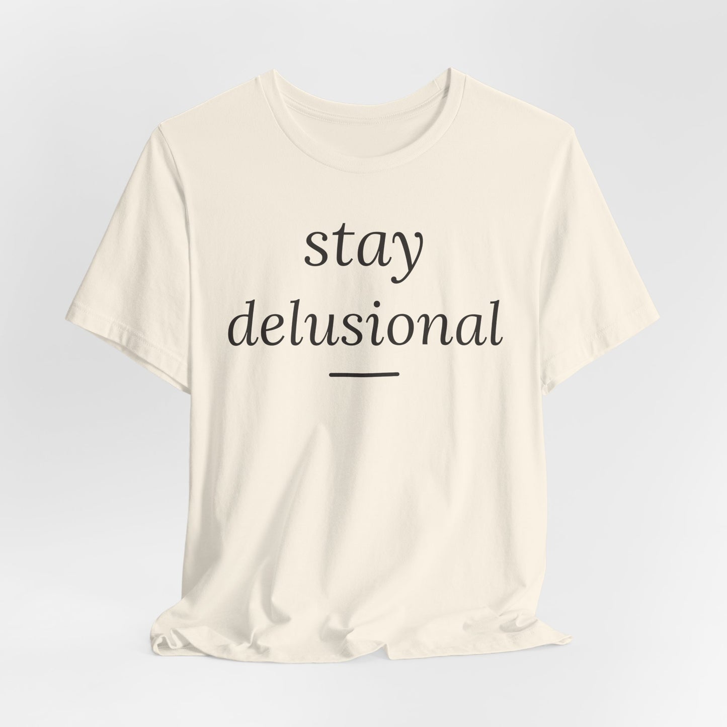 Stay Delusional — Ironic Serif Tee