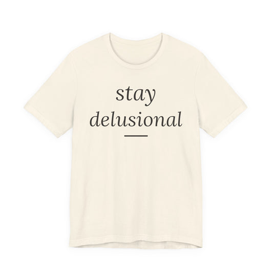 Stay Delusional — Ironic Serif Tee